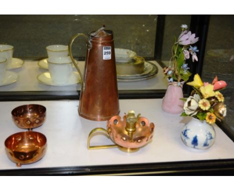 A Benson copper flask, with lid and stylised handle, 22cm high, together with a similar copper and brass candlestick holder, 