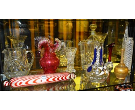 A Nailsea style red swirl glass rolling pin, 37cm long, together with a cranberry glass vase, Victorian and later glass vases