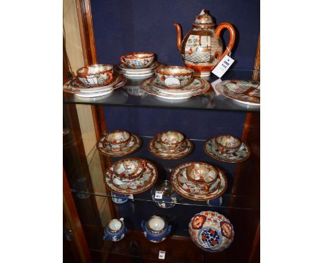 A Japanese Satsuma eggshell teaset, comprising of teapot, nine side plates, seven saucers and seven cups (23), together with 