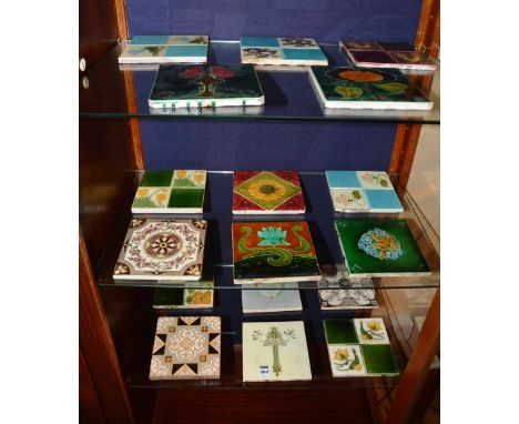A quantity of late Victorian and Art Nouveau ceramic tiles, richly glazed in brown, green, yellow and blue, 15cm high x 15cm 