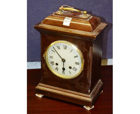 A George III style mahogany bracket clock, with brass carry handle, white enanel dial and Roman numerals, 33cm high