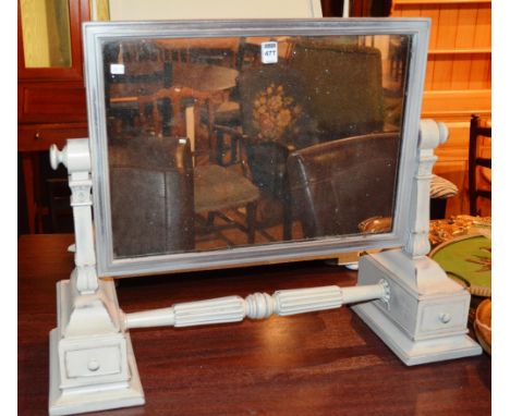 A Victorian grey painted dressing mirror, with swing plate glass mirror flanked by shaped column support with turned under st