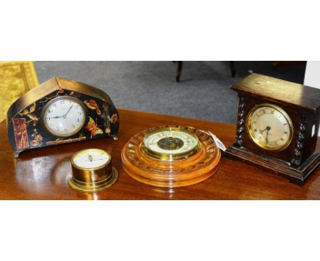 A carved mahogany circular barometer, with cream enamel dial, 23cm diameter, together with a French lacquered mantle clock, R
