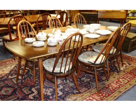 A dark Ercol dining table, with six matching spindle back chairs, 70cm high x 150cm long x 83cm wide (7) CONDITION REPORT: Lo