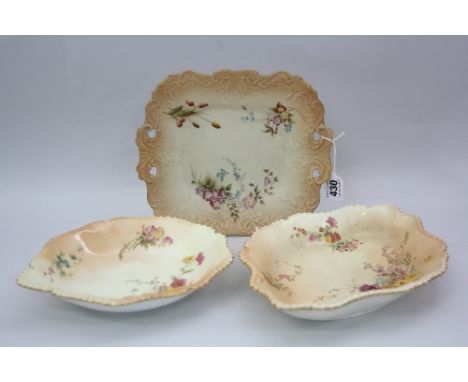 THREE ROYAL WORCESTER BLUSH IVORY FLORAL SPRAY DECORATED PLATES, shaped square example with pierced scrolls, green marks to b