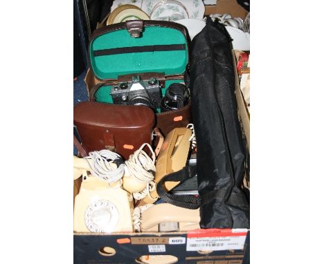 A BOX OF SUNDRIES, to include telephones, barometer, cased Praktica camera and a tripod, cased binoculars etc