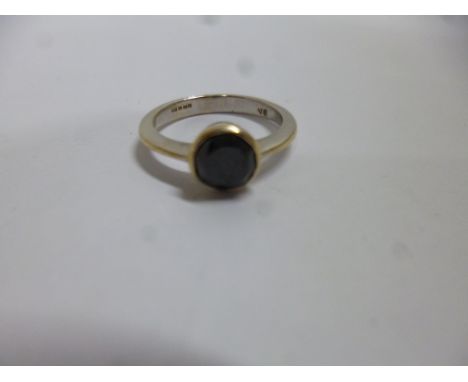 A BLACK DIAMOND RING, with 0.50ct estimated diamond to a plain tapered band, stamped 9k, ring size K