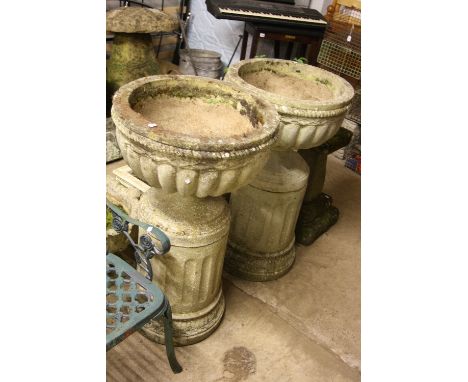 A PAIR OF COMPOSITE COMPAGNA STYLE GARDEN URNS, on separate pillar bases, approximate size height 98cm
