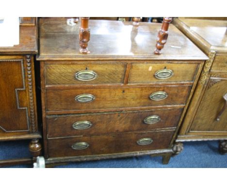 A GEORGIAN OAK CHEST, of two short and three long drawers on bracket feet supports (sd)