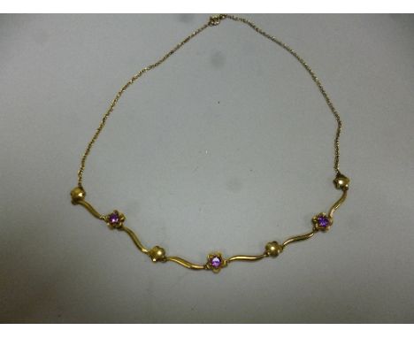 A 9CT GOLD AMETHYST NECKLACE, with flower shape detail, length 42cm, weight 73 grams, hallmarks for Birmingham