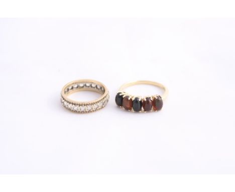 TWO 9CT GOLD RINGS, the first a full band paste eternity ring, together with a five stone gemset ring, hallmarks for Birmingh