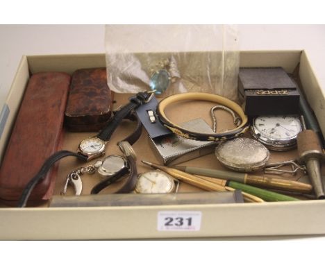 A TRAY OF MISCELLANEOUS ITEMS, to include pens, watches, a lighter, etc