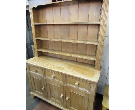 C20th Victorian style pine dresser with three open tier raised back, the base with three drawers and three cupboards on brack