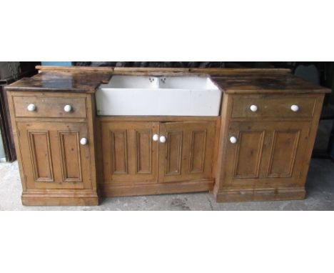 Double Belfast sink with white ceramic handles set in pine surround, W216cm D71cm H90cm