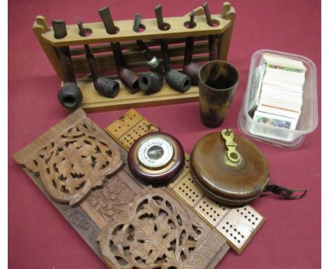 Wooden pipe rack containing Guildhall, Kako, Parker and other pipes, Rabone leather cased tape measure, bone cribbage marker,