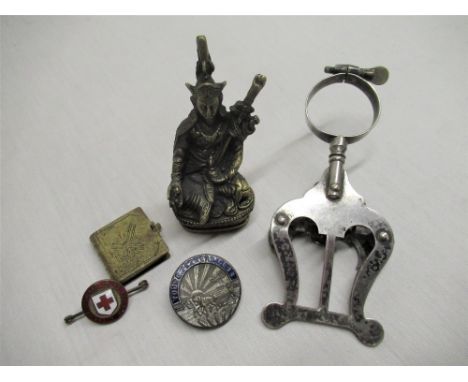 Cast brass figure of oriental deity, chromium plated instrument music holder, Young Farmer's Club lapel pin, enamel badge "Th