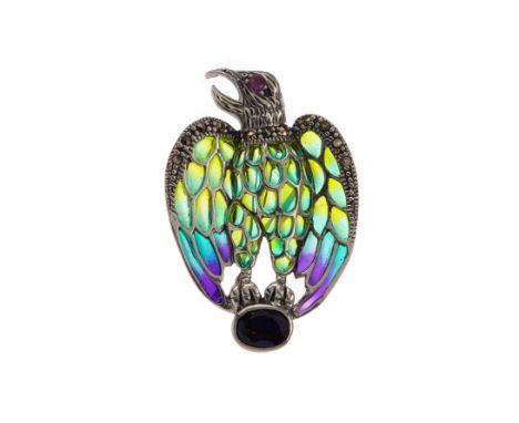 PLIQUE A JOUR EAGLE BROOCH, with a round ruby eye and enamelled wings bordered by marcasites, perched upon an oval sapphire, 