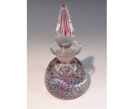 A Perthshire paperweight inkwell, millieflori base, lofty stoper, 13cm high, paper label