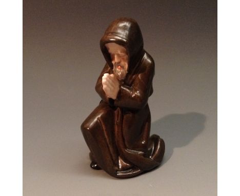 A rare Royal Worcester/ Kerr and Binns candle snuffer, Kneeling Monk, praying, in brown and flesh tones, 10cm high, unmarked,