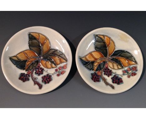A pair of contemporary Moorcroft Blackberry pattern circular trinket dishes, glazed in autumnal tones, impressed marks, monog