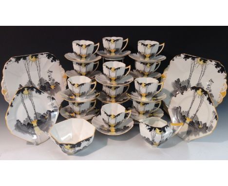 A Shelley Queen Anne shape Sunlight Through Tall Trees pattern tea set, comprising twelve teacups, twelve saucers, twelve tea