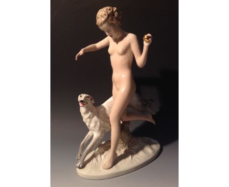 A Royal Dux Art Deco model of a lady naked, running with a Borzoi dog, light coloured in flesh tones and grey, 37cm high, 