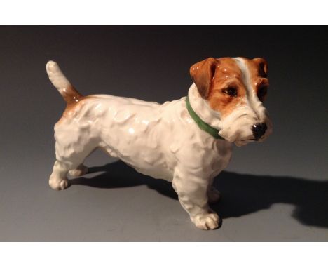 A Royal Worcester model, of a long haired terrier, tan markings, green colour, 15cm long, printed crown and circle mark in bl