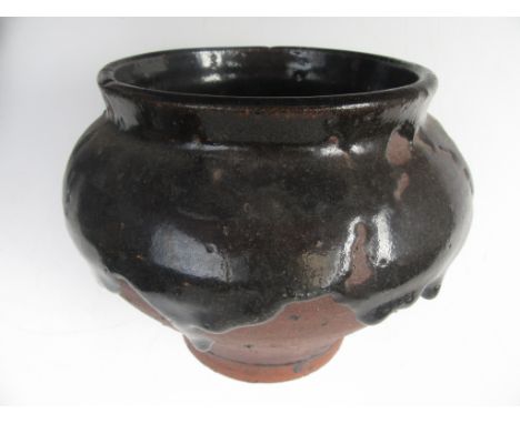 An early Bernard Leach stoneware vase, with thick running tenmoko glaze, impressed pottery and personal script seal. Height: 