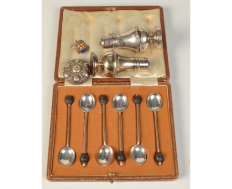 A set of six silver bean finial coffee spoons cased together with a pair of silver condiments and one other piece.