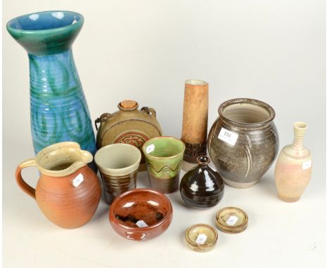 Twelve items of studio pottery, including a Michael Leach vase, height 15.5cm and a Mary Rich vase, height 16cm. 