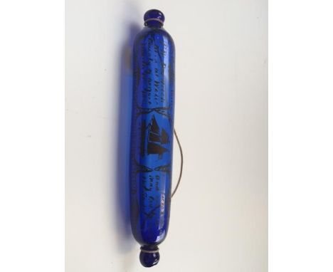 A blue glass rolling pin painted with a frigate with an inscription dated 1834.