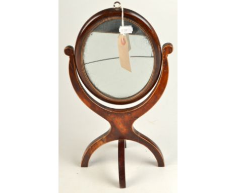 A toilet mirror with folding stand.