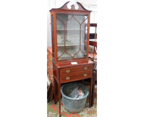 An Edwardian satinwood cross banded mahogany cabinet with swan neck pediment, turned brass urn finial and single lattice glaz