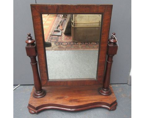 A Victorian mahogany veneered toilet mirror.