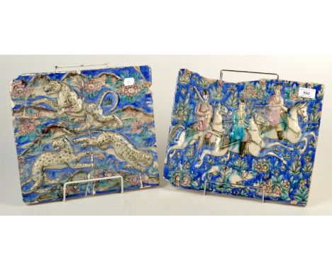 Two 19th century Persian ceramic tiles, the first, the blue floral ground decorated with three huntsmen on horseback above a 
