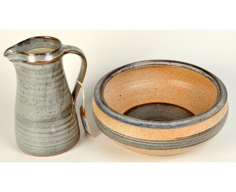 A Leach Pottery standard ware jug, impressed seal mark to side, height 21cm, together with a large unmarked bowl. 