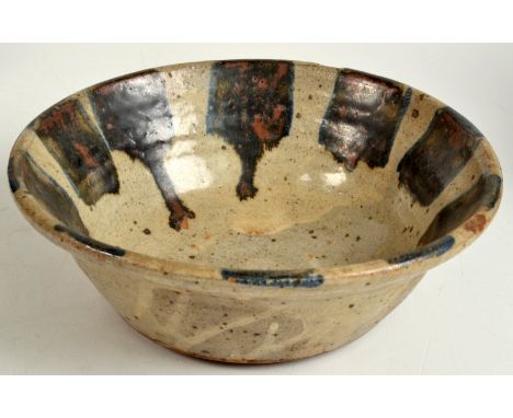 A Leach stoneware bowl, the interior rim with bold brush strokes of tenmoko bordered with blue. Pottery and personal marks. D