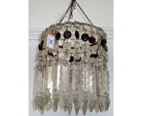 A circular, lustre hung chandelier and a pair of miniature chandeliers. 