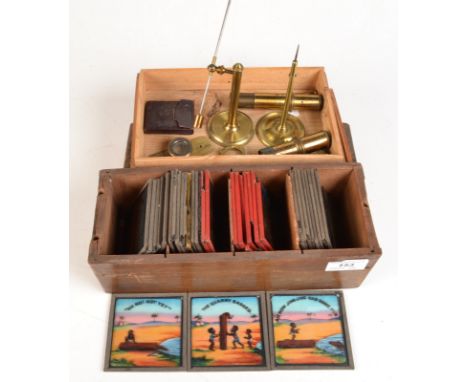 A box of coloured magic lantern slides, including a set of eight 'Our Fireman', eight of Mr Short and Mr Long, together with 