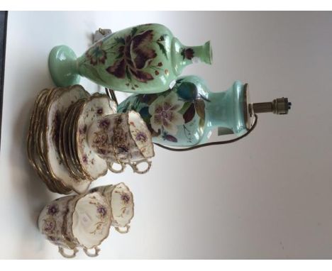 A Victorian painted glass vase mounted as a table lamp, one other glass vase and a part tea service.