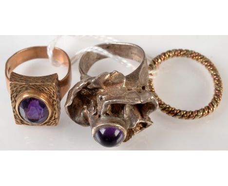 Two 1970's amethyst set rings one in 9ct gold the other silver, together with a three colour spiral wire 9ct gold ring.   Con
