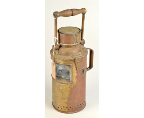 A brass maritime signalling lamp by Arthur J Poole with candle holder.