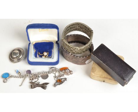 Three silver brooches, a silver hinged bangle, a silver bracelet etc. 