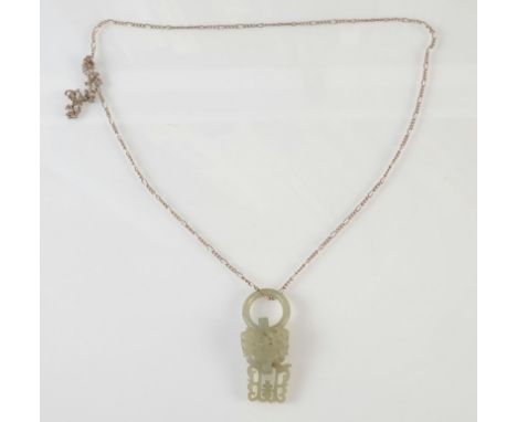 A Chinese jade pendant on a silver chain, height 4.5cm. 