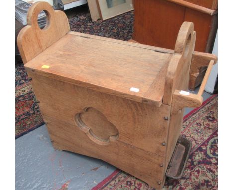 A light oak small hall bench with box seat and umbrella rack.