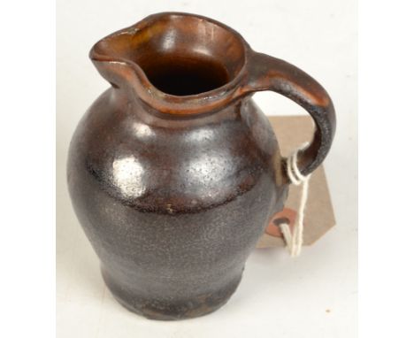 An early Bernard Leach miniature jug with incised seal to front, script seal mark, height 8cm.   Condition Report: Condition 