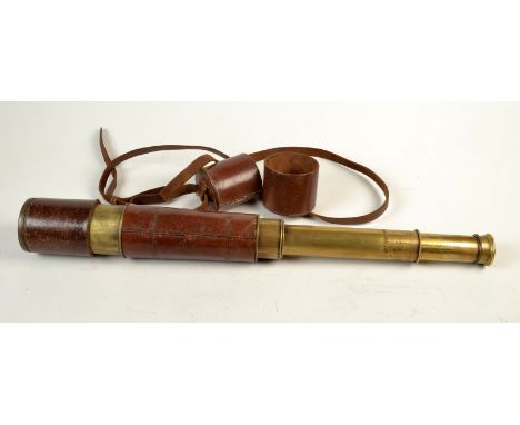 A brass and brown leather clad 6cm four draw telescope by Broadhurst Clarkson & Co. 63 Farrington Rd, London, in a leather ca