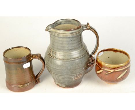 A Leach Pottery jug inscribed with the Cornish motto 'One & All', impressed seal mark, height 20cm, together with an unmarked