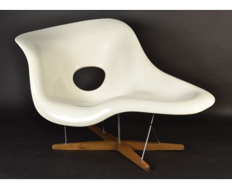 The white fiberglass La Chaise lounge chair by Vitra designed by Charles and Ray Eames in 1948 for the Museum of Modern Art's