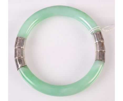 An imperial green veined jade bangle silver mounted in the form of bamboo. 